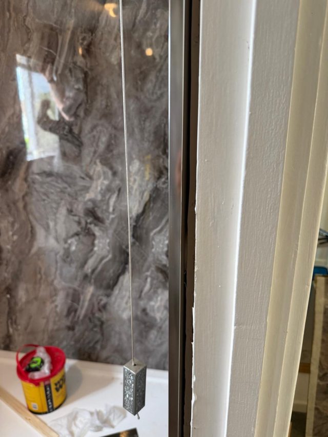 Marble wall panels installed during bathroom renovation in Pill